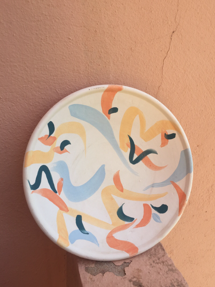 Painted ceramic plate with colourful abstract brushstrokes