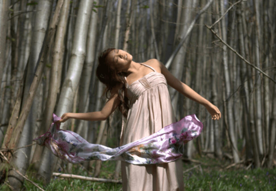 Lucy moving with a scarf in a forest