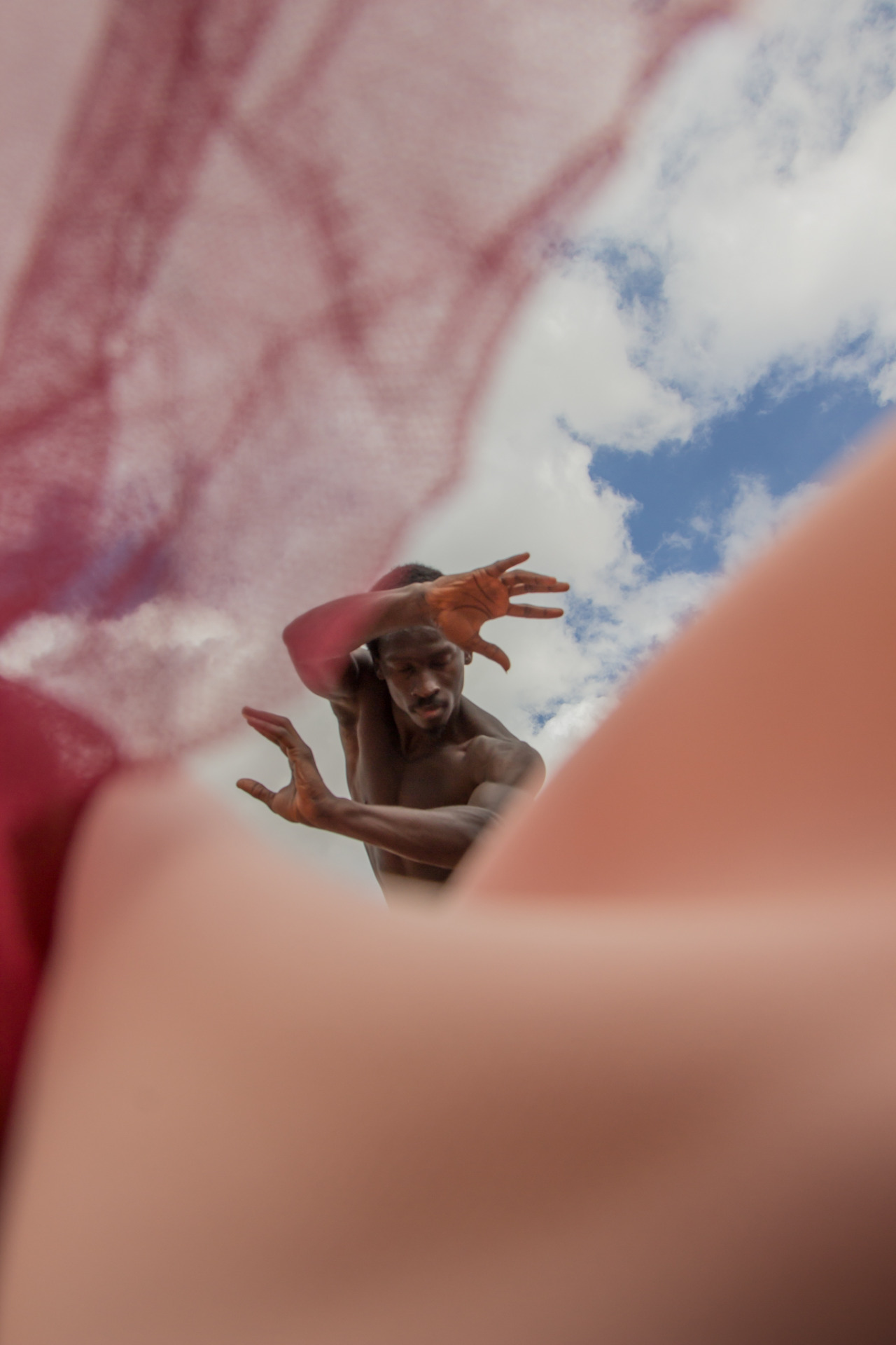 Dreamlike portrait viewed through translucent fabric