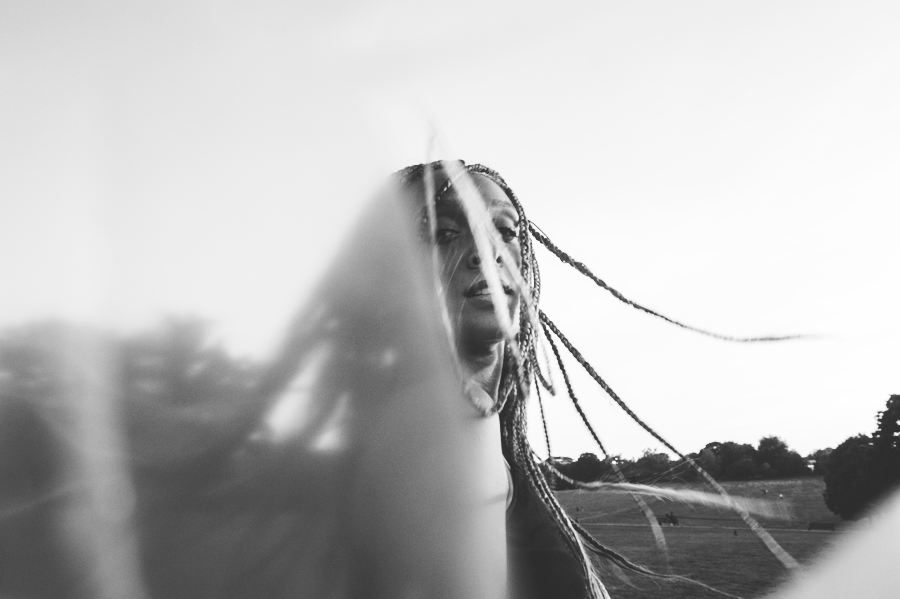 Black and white portrait with windblown strands